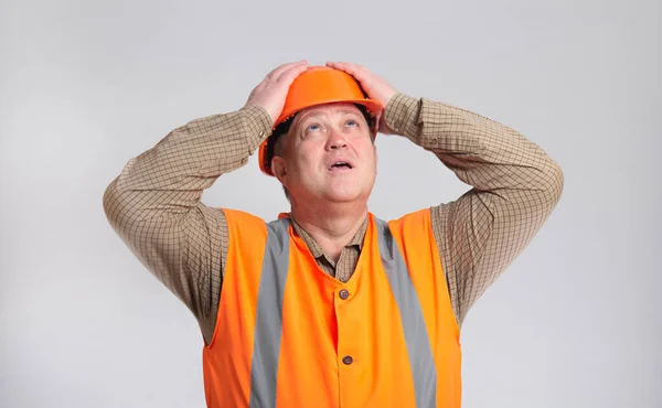 Plump Contruction Worker Clutching His Head Helmet Grey Studio Background — Stock Photo, Image