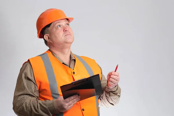 Middle Aged Fat Thinking Engineer Hard Hat Documents Grey Studio — Stock Photo, Image