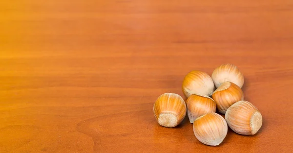 Hazel nuts on a table — Stock Photo, Image