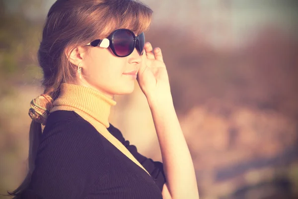 Vintage photo of a beautiful girl in sunglasses — Stock Photo, Image