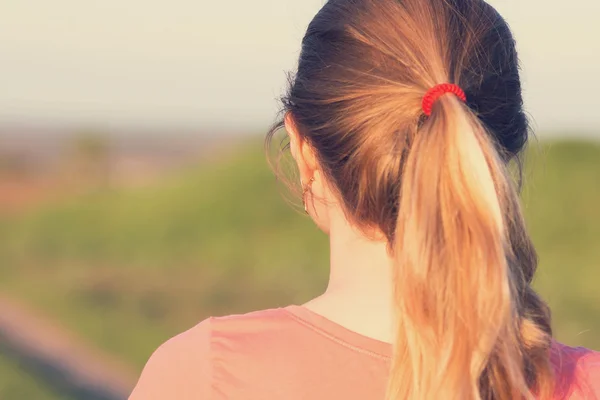 girl with a ponytail hairstyle for sports