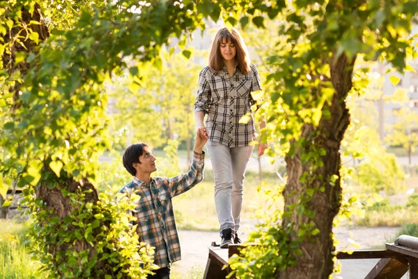 Loving couple walking in a city park in spring — Stock Photo, Image