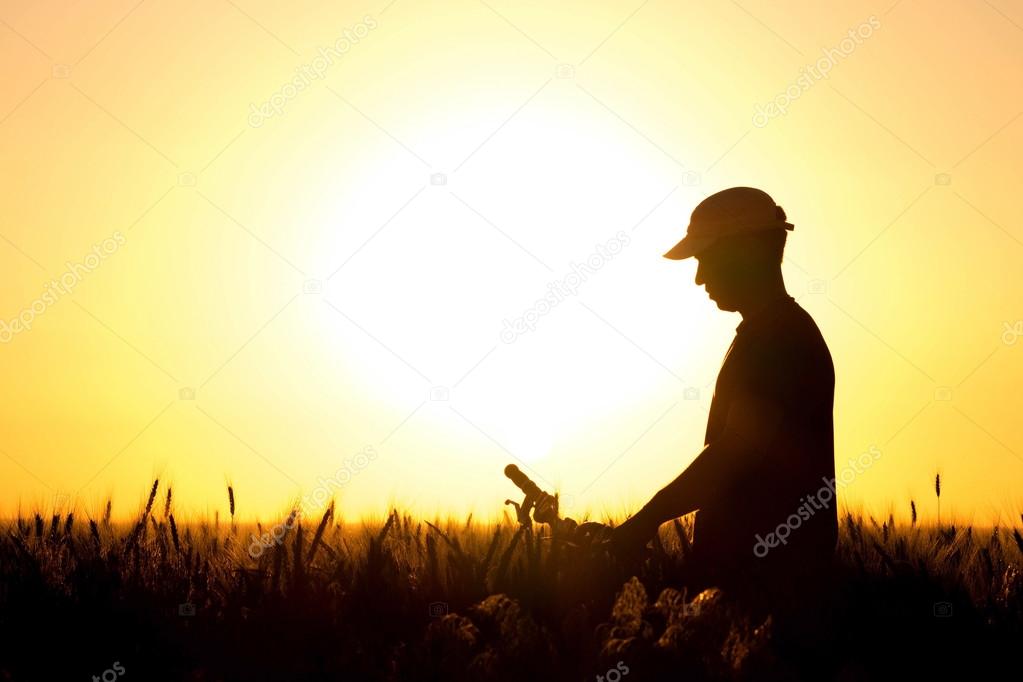young boy on a bicycle in the field