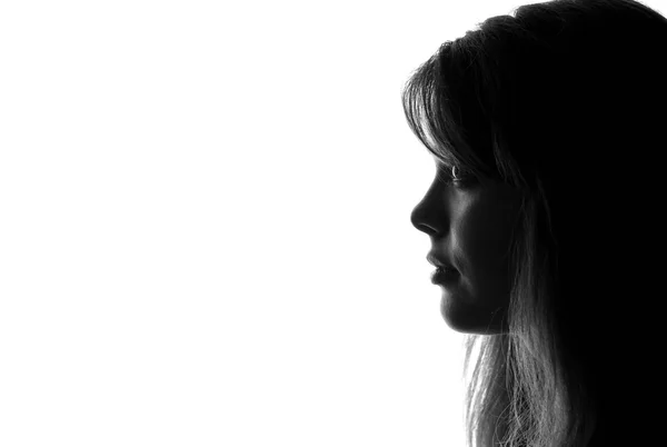 Silhouette of a beautiful sad girl — Stock Photo, Image