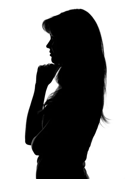 Silhouet van een peinzende vrouw op een witte achtergrond — Stockfoto