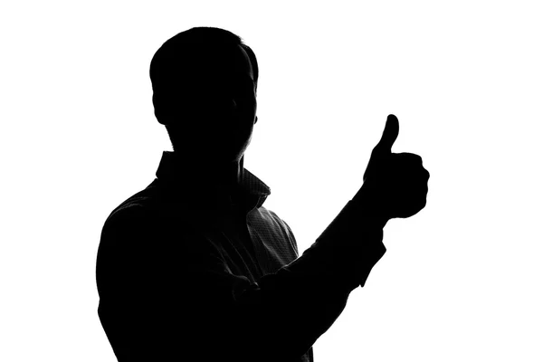 Mladý muž ukazuje palec — Stock fotografie