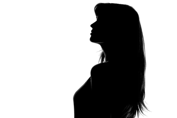 Silhueta de uma mulher pensativa em um fundo branco — Fotografia de Stock