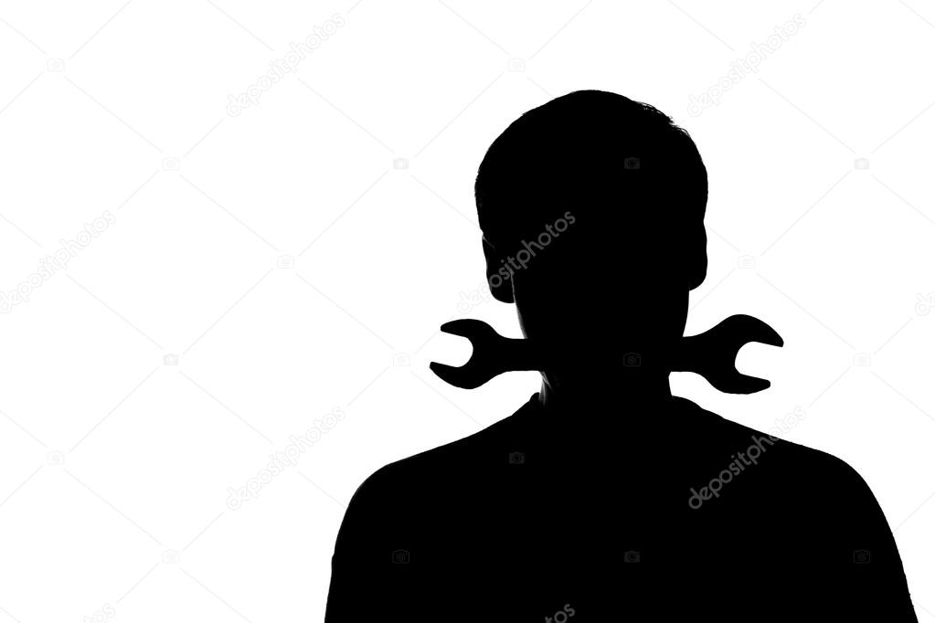 A young man with a wrench in his teeth - silhouette