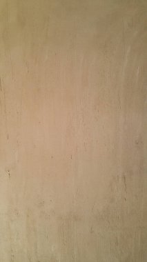 Sıvalı duvar kahverengidir. Odanın içindeki duvar. Çizikli arka plan fotoğrafı. Mimarlık ve inşaat. İç dizayn. Uzayı metin için kopyala. Dikey konum.