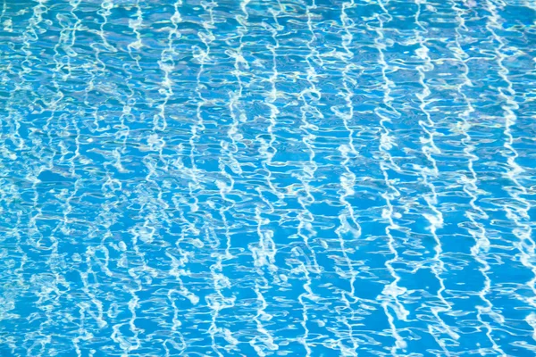 Hotel swimming pool with sunny reflections — Stock Photo, Image