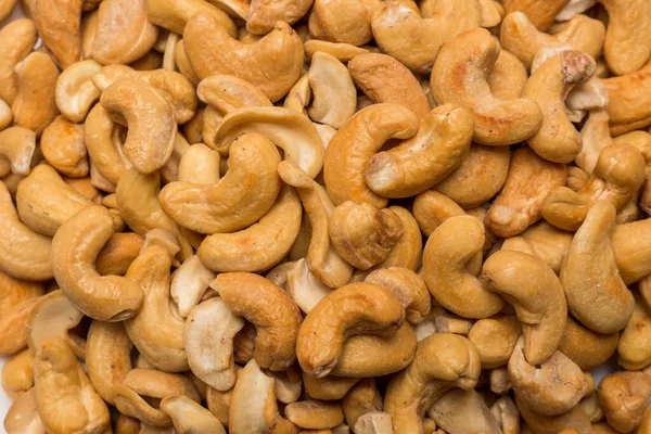 Whole cashew nuts background. Vegetarian healthy snack. Organic food. Vegetable diet.