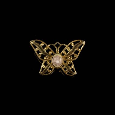 gold vintage brooch with crystals in the shape of a butterfly clipart