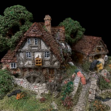 antique ceramic figurine of a rural house. antique figurine of the english house