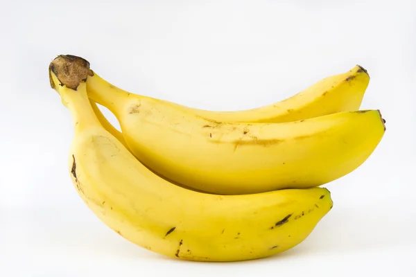Бананы на белом фоне — стоковое фото