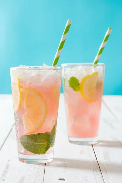 Fresh watermelon mojito on blue background — Stock Photo, Image