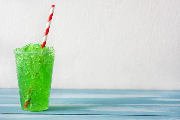 Kiwi slushie on blue wood — Stock Photo, Image