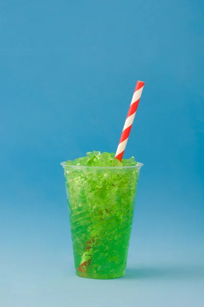 Green slushie. Blue background — Stock Photo, Image