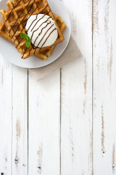 Waffles with ice cream on a white wooden table — Stock Photo, Image