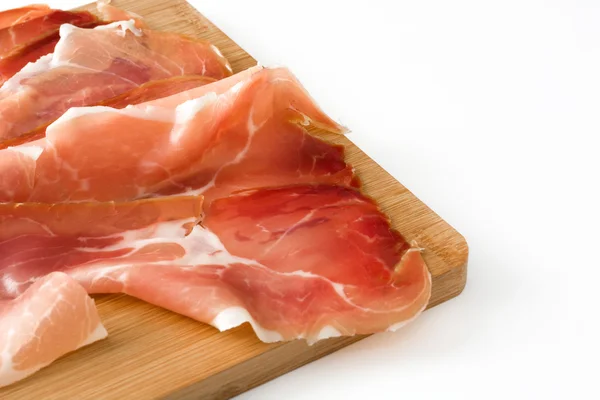 Thin slices of spanish serrano ham on a table isolated on white background — Stock Photo, Image
