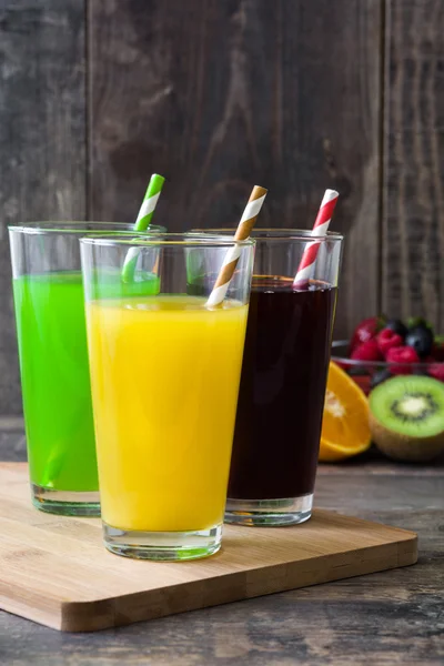 Fresh fruit smoothies on a rustic wooden background — Stock Photo, Image