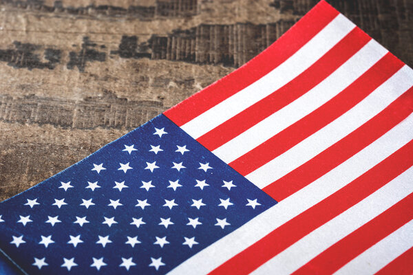 United States flag on a rustic wooden background