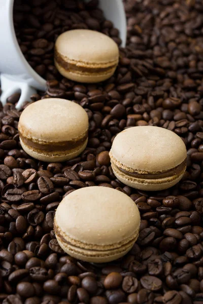 French coffee macaroons and coffee beans background