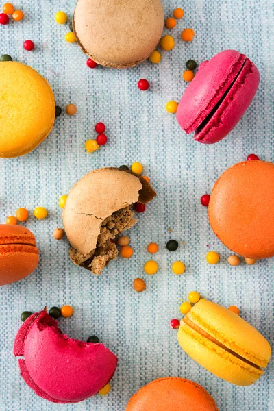 Colored macaroons on blue background — Stock Photo, Image