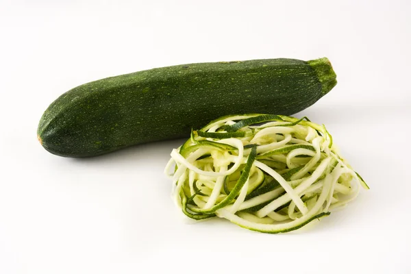 Delicious zucchini noodles isolated on white background — Stock Photo, Image