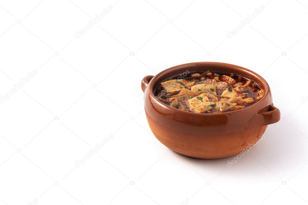Traditional mondongo or el menudo soup isolated on white background