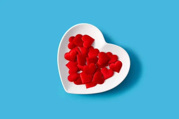 Heart Shaped Plate Red Hearts Blue Background — Stock Photo, Image