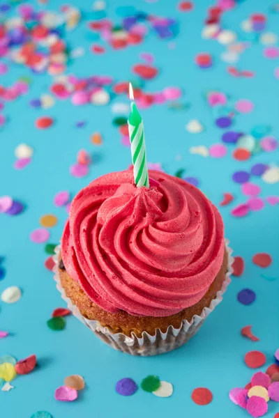 Pink Birthday Cupcake Green Candle Colorful Confetti Blue Background — Stock Photo, Image