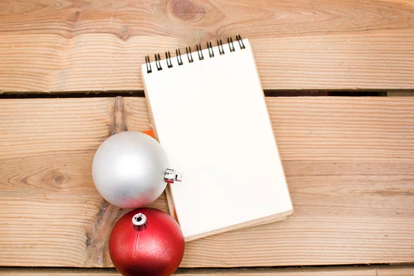 Notebook and Christmas balls — Stock Photo, Image