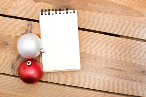 Notebook and Christmas balls — Stock Photo, Image