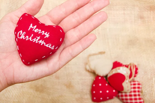 Christmas heart in hand — Stock Photo, Image