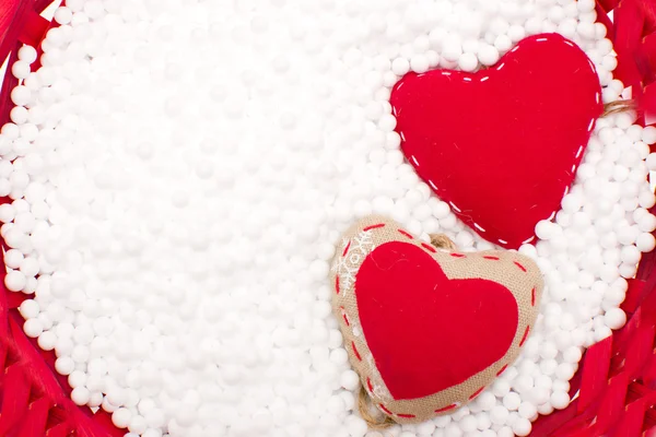 Two red hearts in snow — Stock Photo, Image