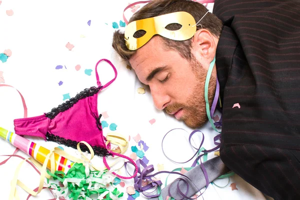 Young man sleeping after a party — Stock Photo, Image