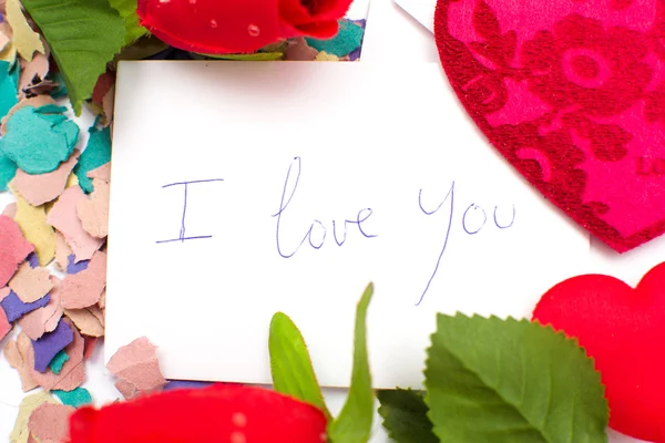 Rose and note saying I love you — Stock Photo, Image