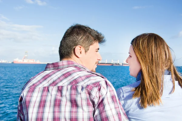 Young woman and young man on a marina — Stock Photo, Image