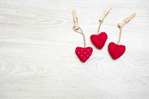 Red hearts on wood — Stock Photo, Image