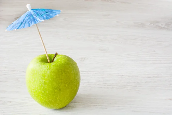 Umbrella and apple — Stock Photo, Image