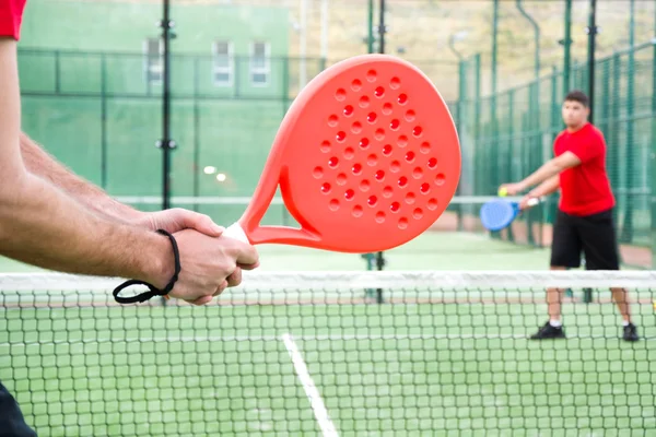 friends playing paddle tennis