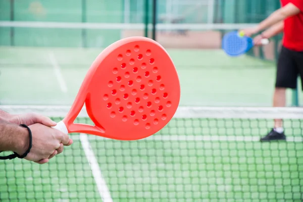 friends playing paddle tennis