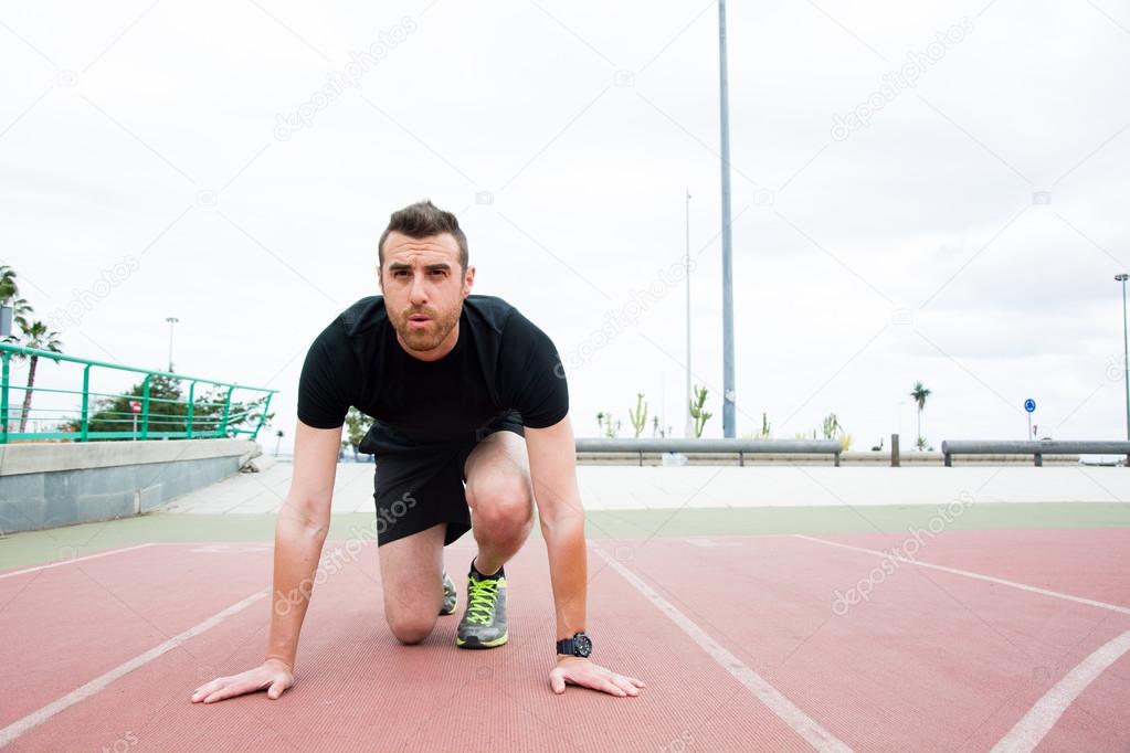 Man ready to run on the track