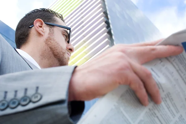 Businessman reading newspaper — Stock Photo, Image