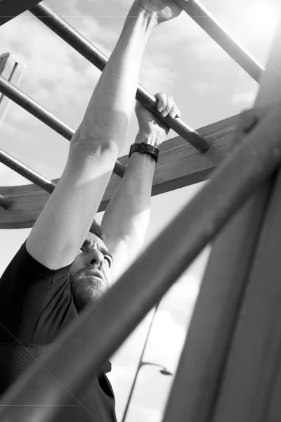 Young man practicing exercise — Stock Photo, Image