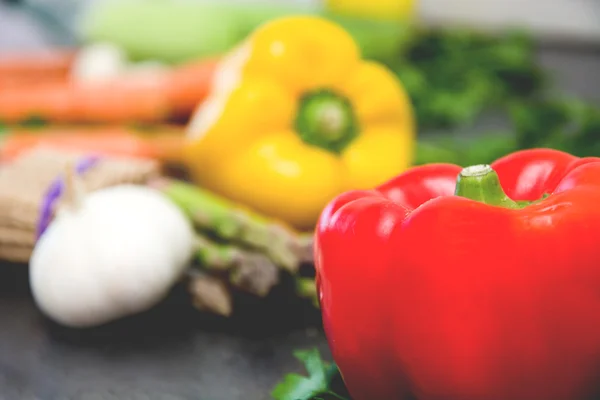 Peppers and other vegetables on slate table. Old style — Stock Photo, Image