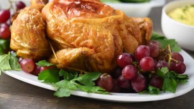Thanksgiving dinner on rustic wooden table with roasted turkey,mashed potatoes,ears of corn and green bean casserole