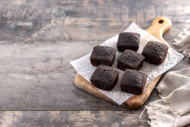 Homemade chocolate brownies  on wooden table. Copy space