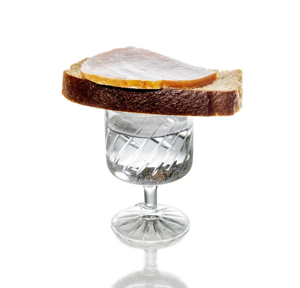 A glass of vodka with a sandwich there, isolated — Stock Photo, Image