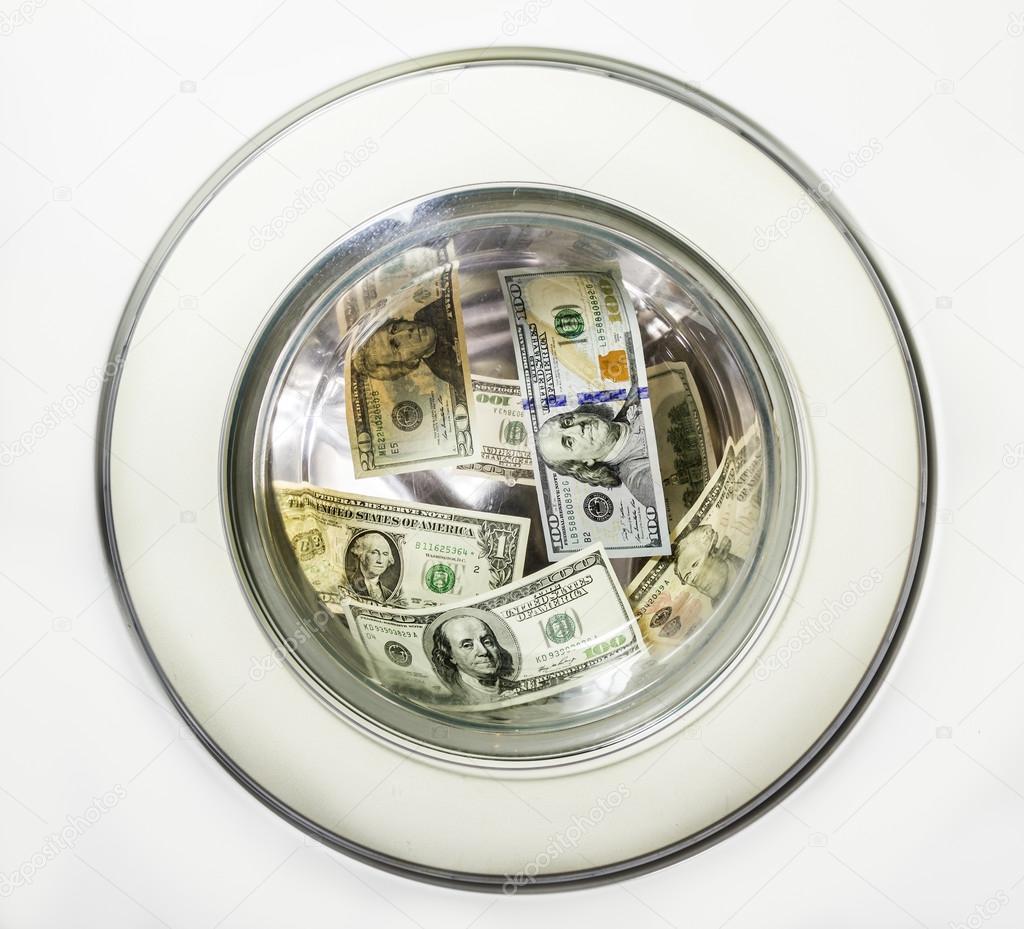 Dollar bills in the drum of the washing machine